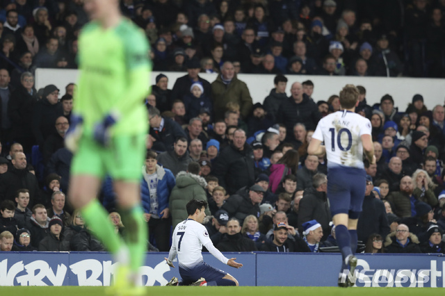 Tottenham's Son Heung-min, center, celebrates after scoring during the English Premier League soccer match between Everton and Tottenham at Goodison Park Stadium, in Liverpool, England, Sunday, Dec. 23, 2018.(AP Photo/Jon Super)
