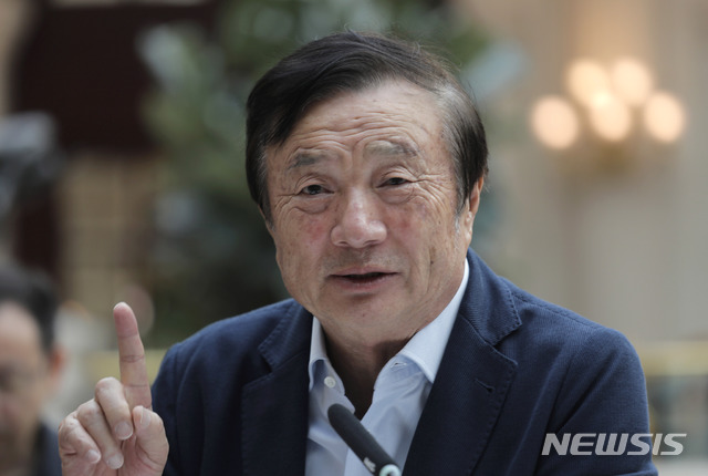 Ren Zhengfei, founder and CEO of Huawei, gestures during a round table meeting with the media in Shenzhen city, south China's Guangdong province, Tuesday, Jan. 15, 2019. The founder of network gear and smart phone supplier Huawei Technologies said the tech giant would reject requests from the Chinese government to disclose confidential information about its customers. (AP Photo/Vincent Yu)