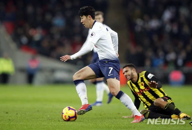 Tottenham's Son Heung-Min goes for the ball during the English Premier League soccer match between Tottenham Hotspur and Watford at Wembley Stadium in London, Wednesday, Jan. 30, 2019.(AP Photo/Frank Augstein)