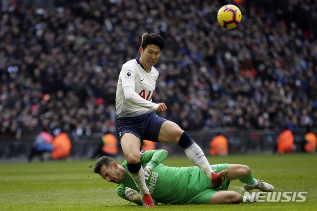 Newcastle goalkeeper Martin Dubravka, background and Tottenham's Son Heung-min vie for the ball during the English Premier League soccer match between Tottenham Hotspur and Newcastle at Wembley Stadium in London, Saturday, Feb. 2, 2019. (AP Photo/Tim Ireland)
