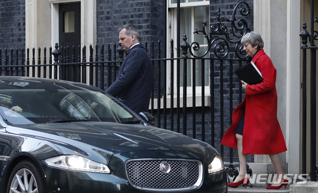 Britain's Prime Minister Theresa May leaves 10 Downing Street to make a statement to the Houses of Parliament in London, Tuesday, Feb. 26, 2019. (AP Photo/Alastair Grant)