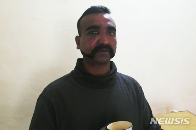 This still image taken from video circulated by Pakistan’s military shows a man who identified himself as the pilot of an Indian military aircraft that was shot down Wednesday, Feb. 27, 2019, over a part of the mountainous Kashmir region controlled by Pakistan. (Pakistan Armed Forces via AP)