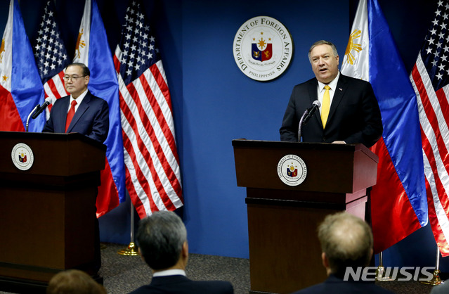 U.S. State Secretary Mike Pompeo, right, answers question during his joint news conference with Philippine Foreign Affairs Secretary Teodoro Locsin Jr. in suburban Pasay city southeast of Manila, Philippines Friday, March 1, 2019. Pompeo, who joined U.S. President Donald Trump in the second summit with North Korean leader Kim Jong-un in Vietnam, is here for talks on the two countries' relations as well as the mutual defense treaty. (AP Photo/Bullit Marquez)