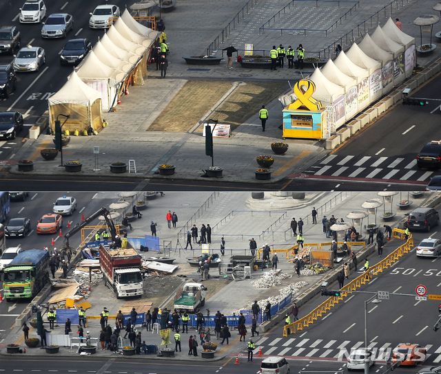 【서울=뉴시스】김선웅 기자 = 지난 18일 오후 서울 광화문광장 세월호 천막이 철거돼있다. 천막 철거는 지난 2014년 7월 설치된 이후 약 5년만이다. 위 사진은 18일 오전 철거 직전의 모습. 2019.03.18. mangusta@newsis.com