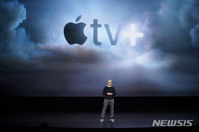Apple CEO Tim Cook speaks at the Steve Jobs Theater during an event to announce new products Monday, March 25, 2019, in Cupertino, Calif. (AP Photo/Tony Avelar)