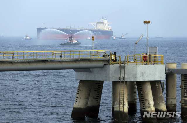 FILE - In this Sept. 21, 2016 file photo, an oil tanker approaches to the new Jetty during the launch of the new $650 million oil facility in Fujairah, United Arab Emirates. The United Arab Emirates said Sunday, May 12, 2019 that four commercial ships near Fujairah "were subjected to sabotage operations" after false reports circulated in Lebanese and Iranian media outlets saying there had been explosions at the Fujairah port. (AP Photo/Kamran Jebreili)