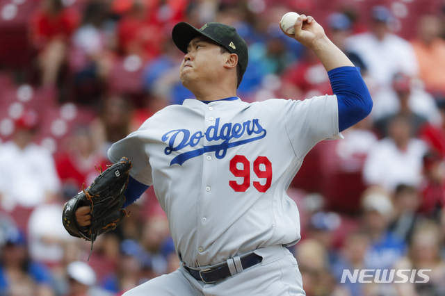 Los Angeles Dodgers starting pitcher Hyun-Jin Ryu throws in the first inning of a baseball game against the Cincinnati Reds, Sunday, May 19, 2019, in Cincinnati. (AP Photo/John Minchillo)