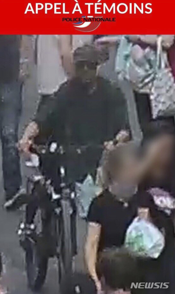 In this May 24, 2019 screen grab taken from the French police website - an image and description of a suspect wanted in connection with an explosion in Lyon. French police are hunting a suspect following an explosion that wounded 13 people in a busy pedestrian street Friday in the city of Lyon. (French Police via AP)