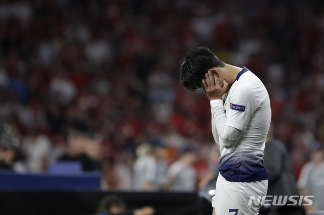 Tottenham's Son Heung-min walks in dejection end of the Champions League final soccer match between Tottenham Hotspur and Liverpool at the Wanda Metropolitano Stadium in Madrid, Sunday, June 2, 2019. Liverpool 2-0. (AP Photo/Felipe Dana)