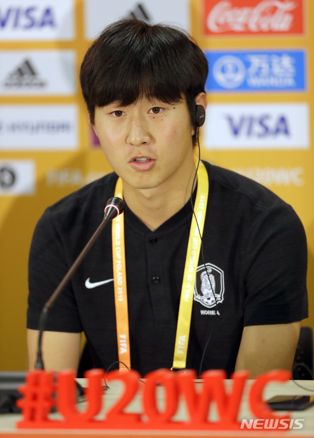 South Korea's Lee Kangin speaks to media during a news conference in Lodz, Poland, Friday, June 14, 2019, ahead of their final U20 World Cup soccer match against Ukraine on Saturday. (AP Photo/Sergei Grits)