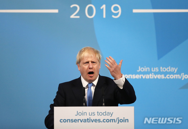 Boris Johnson gestures as he speaks after being announced as the new leader of the Conservative Party in London, Tuesday, July 23, 2019. Brexit champion Boris Johnson won the contest to lead Britain's governing Conservative Party on Tuesday, and will become the country's next prime minister. (AP Photo/Frank Augstein)