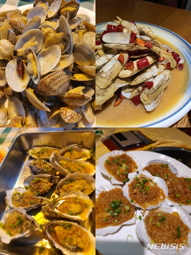[칭다오=뉴시스] 칭다오에서 먹은 다양한 해산물 요리. 바지락, 맛조개, 굴, 가리비를 실컷 먹었다. 