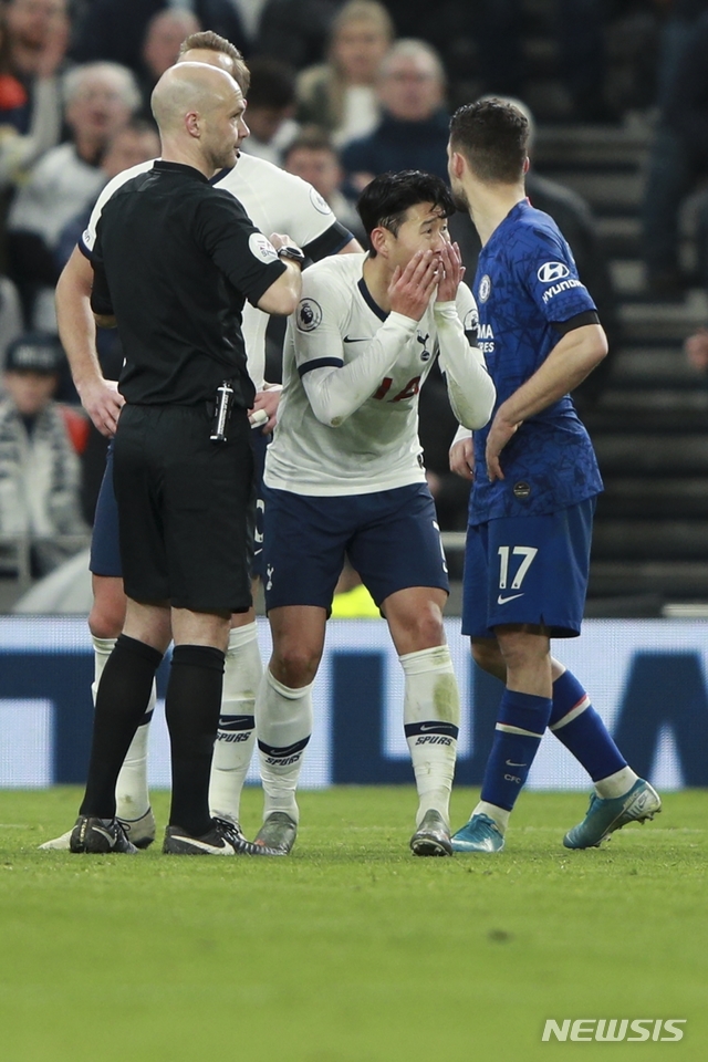 Tottenham's Son Heung-min reacts after getting a red card during the English Premier League soccer match between Tottenham Hotspur and Chelsea, at the Tottenham Hotspur Stadium in London, Sunday, Dec. 22, 2019. (AP Photo/Ian Walton)