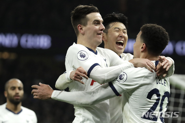 Tottenham's Son Heung-min, center, celebrates with his teammates his goal against Norwich City during the English Premier League soccer match between Tottenham Hotspur and Norwich City at the Tottenham Hotspur Stadium in London, England, Wednesday, Jan. 22, 2020. (AP Photo/Matt Dunham)