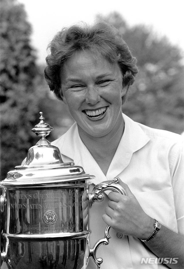 FILE - In this July 1, 1961 file photo, Mickey Wright poses after winning her third Women's National Open golf championship, at the Baltusrol Golf Club at Springfield, N.J. Hall of Fame golfer Wright, who won 82 LPGA tournaments including 13 majors, died Monday, Feb. 17, 2020, of a heart attack, her attorney said. Wright was 85. (AP Photo/File)