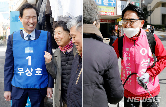[서울=뉴시스] 최동준 기자 = 서대문갑 우상호(왼쪽) 더불어민주당 후보, 이성헌 미래통합당 후보가 지난 3월 16일 서울 서대문구 연세로 일대 상가와 홍제동 아파트 일대에서 각각 주민들과 인사하고 있다. 2020.04.11. photocdj@newsis.com
