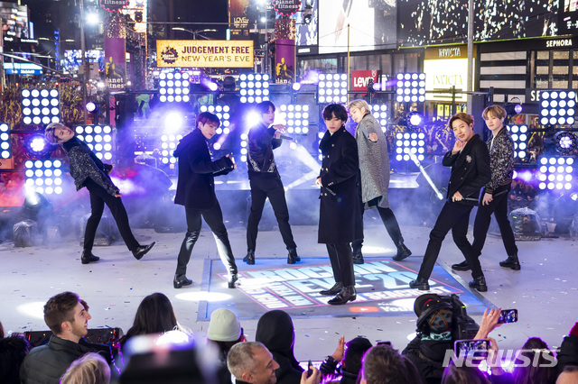 FILE - Members of BTS perform at the Times Square New Year's Eve celebration in New York on Dec. 31, 2019. The K-pop band is nominated for a Grammy Award for best pop duo/group performance with “Dynamite," their first song to hit the No. 1 spot on the Billboard Hot 100 chart. (Photo by Ben Hider/Invision/AP, File)