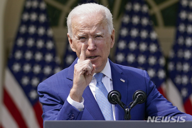 FILE - In this April 8, 2021, file photo President Joe Biden gestures as he speaks about gun violence prevention in the Rose Garden at the White House in Washington. Biden will mark his 100th day in office on Thursday, April 29. (AP Photo/Andrew Harnik, File)