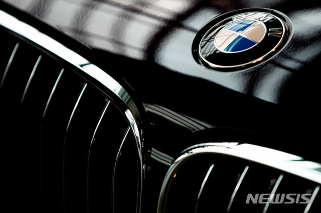 FILE- In this March 21, 2018, file photo, the logo of German car manufacturer BMW is pictured on a BMW 7 in Munich, Germany. Booming sales in China helped propel German luxury carmaker BMW to stronger profits in the first three months of the year even as its home market Germany trailed the ongoing recovery in global car markets from the worst of the pandemic shutdowns. (AP Photo/Matthias Schrader, File)