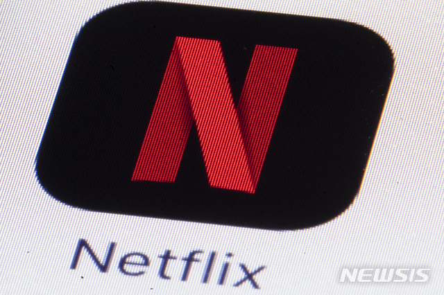 FILE - This Monday, July 17, 2017, file photo shows the Netflix logo on an iPhone in Philadelphia. Streaming services ranging from Netflix to Disney+ want us to stop sharing passwords. That&#039;s the new edict from the giants of streaming media, who hope to discourage the common practice of sharing account passwords without alienating their subscribers, who&#039;ve grown accustomed to the hack. (AP Photo/Matt Rourke, File)