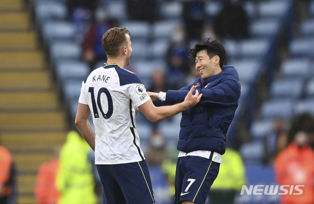 Tottenham's Harry Kane, left, hugs Tottenham's Son Heung-min at the end of the English Premier League soccer match between Leicester City and Tottenham Hotspur at the King Power Stadium, in Leicester, England, Sunday, May 23, 2021.(Shaun Botterill/Pool via AP)