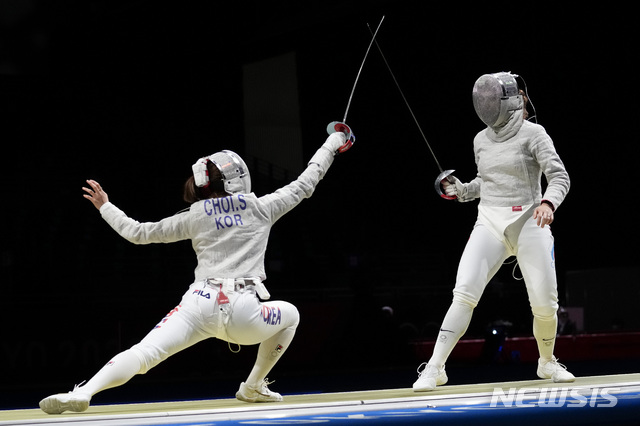 Choi Sooyeon of South Korea, left, and Sofya Velikaya of the Russian Olympic Committee compete in the women's Sabre team semifinal at the 2020 Summer Olympics, Saturday, July 31, 2021, in Chiba, Japan. (AP Photo/Andrew Medichini)
