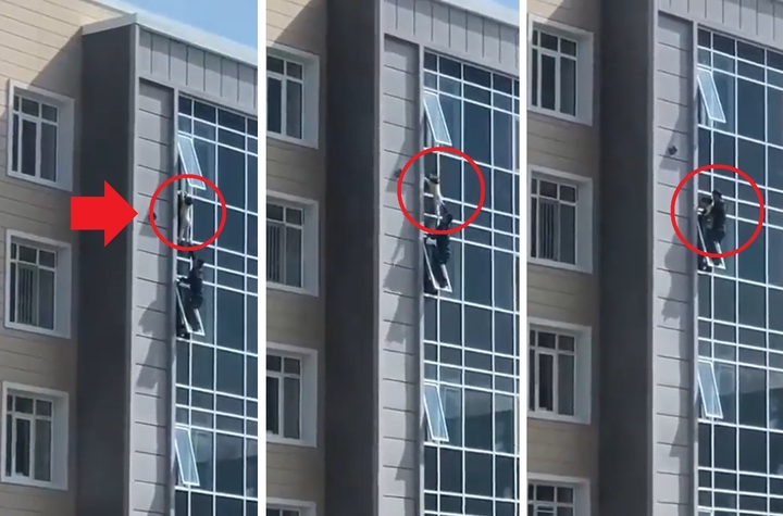[서울=뉴시스] 11일(현지시간) 카자흐스탄 남성 사빗 숀탁바예프가 누르술탄 건물 8층에 매달린 아이를 구하고 있다. (사진=머패치 트위터 갈무리) 2022.05.12. *재판매 및 DB 금지