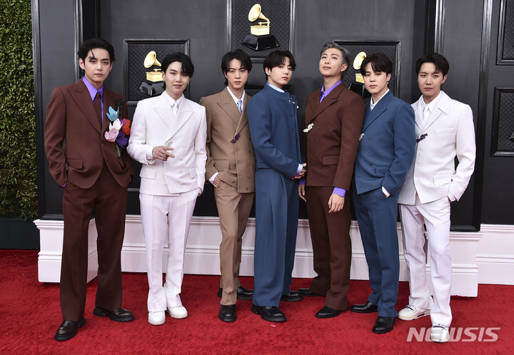 FILE - BTS arrives at the 64th Annual Grammy Awards on April 3, 2022, in Las Vegas. The group says they are taking time to focus on solo projects. The seven-member group with hits like “Butter” and “Dynamite” talked about their future in a video posted June 14, celebrating the nine year anniversary of their debut release.  (Photo by Jordan Strauss/Invision/AP, File)