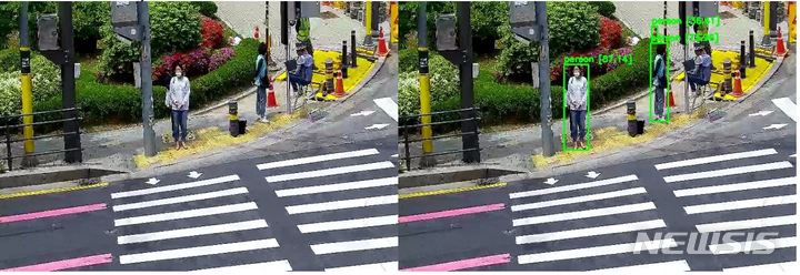 [용인=뉴시스] 매봉초 앞에 설치한 교통사고 방지시스템이 보행자를 인식하고 있다.