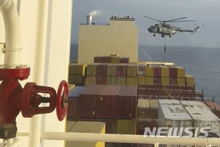 This image made from a video provided to The Associated Press by a Mideast defense official shows a helicopter raid targeting a vessel near the Strait of Hormuz on Saturday, April 13, 2024. A video seen by The Associated Press shows commandos raiding a ship near the Strait of Hormuz by helicopter Saturday, an attack a Mideast defense official attributed to Iran amid wider tensions between Tehran and the West. The Mideast defense official spoke on condition of anonymity to discuss intelligence matters. (AP Photo)