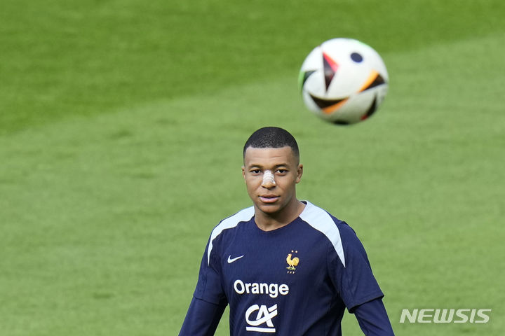 France's Kylian Mbappe gestures as he leaves the field after a training session in Paderborn, Germany, Wednesday, June 19, 2024. France will play against Netherland during their Group D soccer match at the Euro 2024 soccer tournament on June 21. (AP Photo/Hassan Ammar)