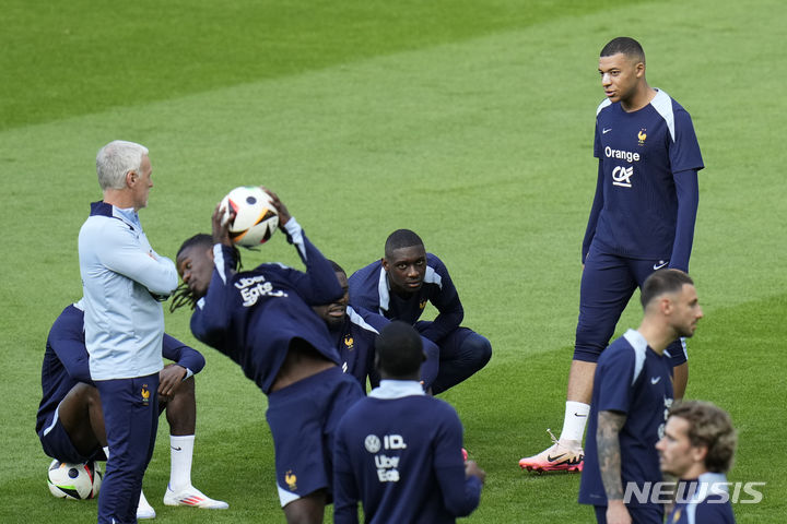 France's Kylian Mbappe gestures as he leaves the field after a training session in Paderborn, Germany, Wednesday, June 19, 2024. France will play against Netherland during their Group D soccer match at the Euro 2024 soccer tournament on June 21. (AP Photo/Hassan Ammar)