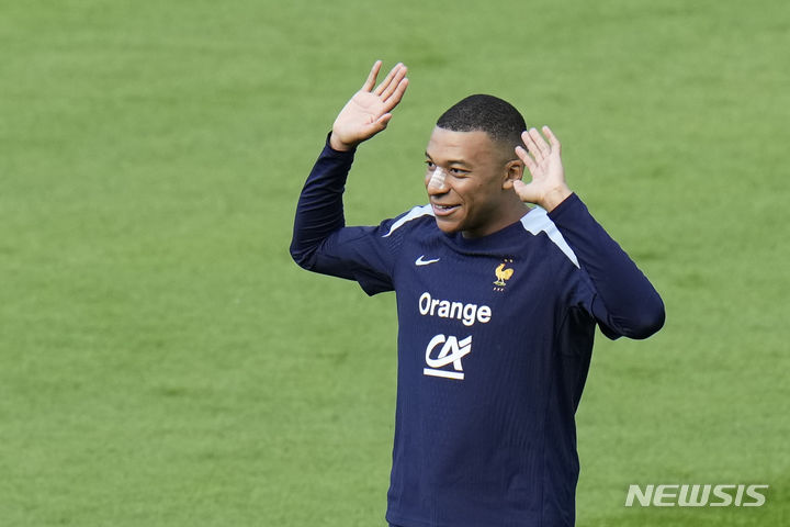 France's Kylian Mbappe runs during a training session in Paderborn, Germany, Wednesday, June 19, 2024. France will play against Netherland during their Group D soccer match at the Euro 2024 soccer tournament on June 21. (AP Photo/Hassan Ammar)