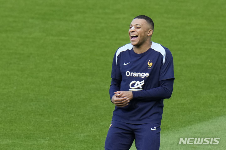 France's Kylian Mbappe runs during a training session in Paderborn, Germany, Wednesday, June 19, 2024. France will play against Netherland during their Group D soccer match at the Euro 2024 soccer tournament on June 21. (AP Photo/Hassan Ammar)