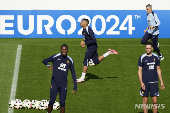 France's Kylian Mbappe gestures as he leaves the field after a training session in Paderborn, Germany, Wednesday, June 19, 2024. France will play against Netherland during their Group D soccer match at the Euro 2024 soccer tournament on June 21. (AP Photo/Hassan Ammar)