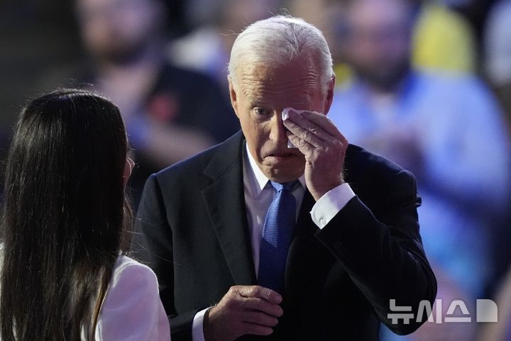 President Biden wipes a tear with his daughter Ashley during the Democratic National Convention Monday, Aug. 19, 2024, in Chicago. (AP Photo/Charles Rex Arbogast)