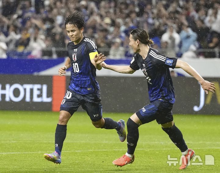 Japan's Takefusa Kubo celebrates after scoring a goal against Indonesia during the World Cup 2026 group C qualifying soccer match in Suita, west Japan, Tuesday, June 10, 2025. (Shohei Miyano/Kyodo News via AP)