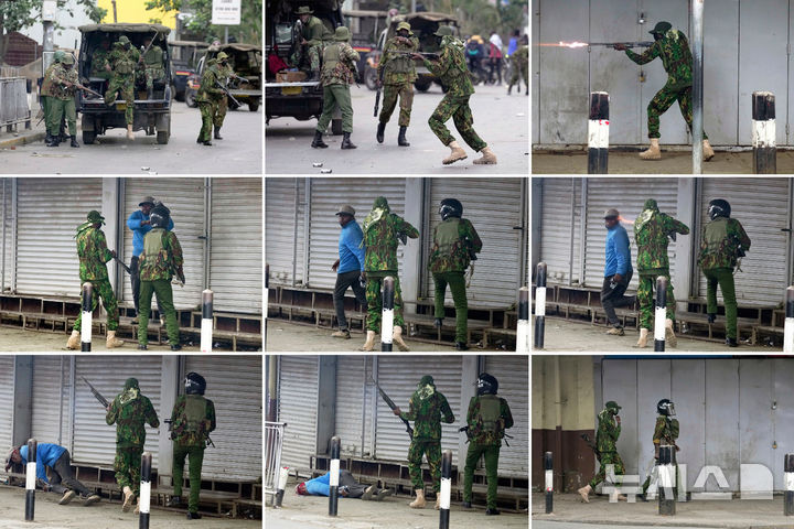 [나이로비=AP/뉴시스] 17일(현지 시간) 케냐 나이로비에서 최근 반정부 블로거 오즈왕이 구금 중 의문사한 것을 두고 진상 규명을 요구하는 대규모 시위가 열린 가운데 경찰이 민간인 추정 남성을 향해 총을 겨누고 있다. 2025.06.18.