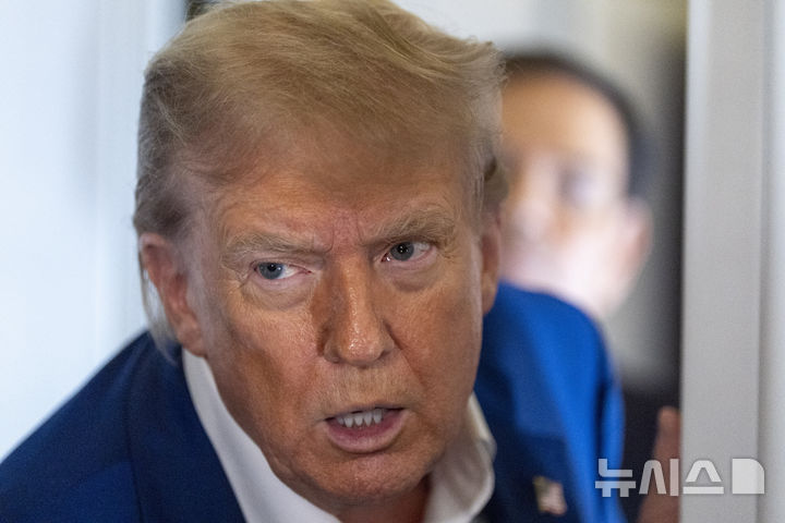 President Donald Trump speaks with reporters on Air Force One while in flight from Joint Base Andrews, Md., to Amsterdam, Netherlands, Tuesday, June 24, 2025. (AP Photo/Alex Brandon)