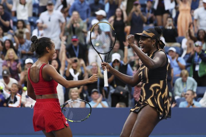 Leylah Fernandez, left, of Canada, and Venus Williams, of the United States, celebrate a win during a third-round doubles match of the U.S. Open tennis championships, Monday, Sept. 1, 2025, in New York. (AP Photo/Heather Khalifa)