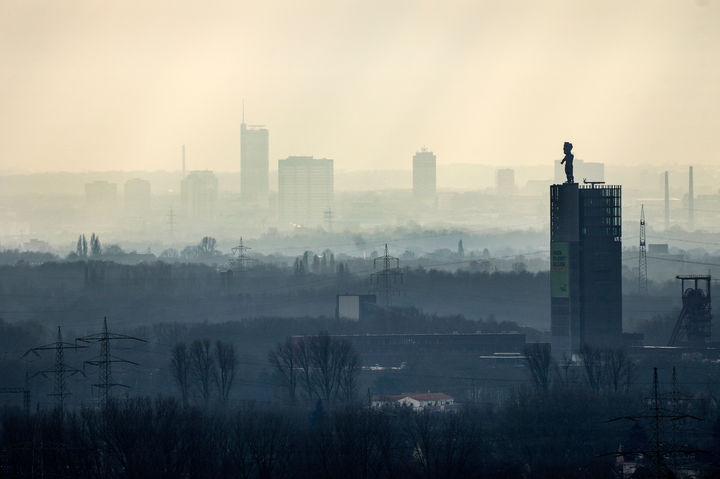 FILE - The city center of Essen is seen through the fog as German Federal Environment Agency warns about poor air quality in Germany due to fine dust pollution, Essen, Germany, Feb. 12, 2025. (AP Photo/Martin Meissner, File)