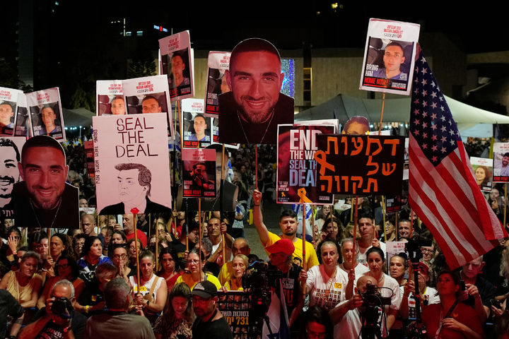 People attend a rally calling for the release of all hostages held by Hamas in the Gaza Strip and urges a ceasefire, in Tel Aviv, Israel, Saturday, Oct. 4, 2025. ahead of the second anniversary of the Israel-Hamas war. (AP Photo/Ohad Zwigenberg)