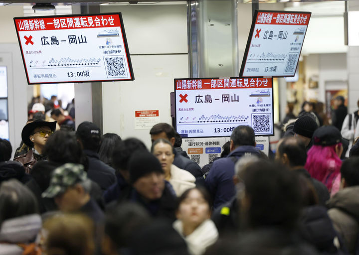 People crowd at a station in Osaka, western Japan Tuesday, Jan. 6, 2026 as bullet train services were suspended at some sections following a strong earthquake in western Japan. (Atsuhiro Maeda/Kyodo News via AP)