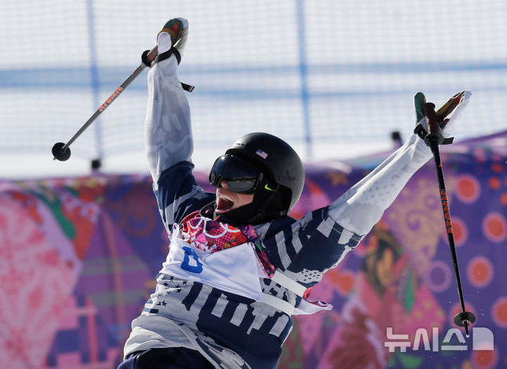 FILE - Gus Kenworthy of the United States celebrates at the end of his second run in the men's ski slopestyle final at the Rosa Khutor Extreme Park at the 2014 Winter Olympics, Thursday, Feb. 13, 2014, in Krasnaya Polyana, Russia. Kenworthy took the silver medal. (AP Photo/Andy Wong, File)