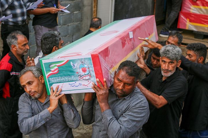 A coffin is carried during the funeral of mostly children killed in what Iranian officials said was an Israeli-U.S. strike Feb. 28 at a girls' elementary school in Minab, Iran, Tuesday, March 3, 2026. (Abbas Zakeri/Mehr News Agency via AP)