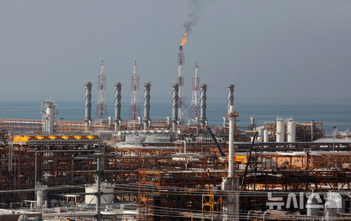 FILE - A partially constructed gas refinery at the South Pars gas field is seen on the northern coast of Persian Gulf in Asalouyeh, Iran, on Jan. 22, 2014. (AP Photo/Vahid Salemi, File)