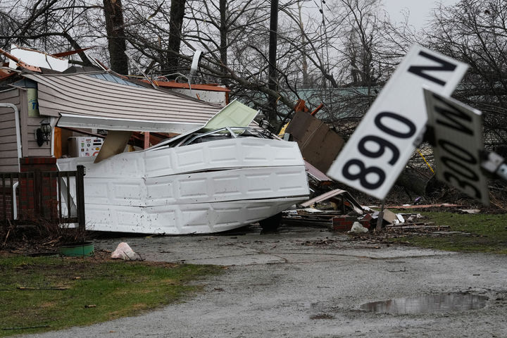 Wind damage and debris sit at a home in the aftermath of a powerful storm that ripped through the area a day earlier in Lake Village, Ind., Wednesday, March 11, 2026. (AP Photo/Nam Y. Huh)