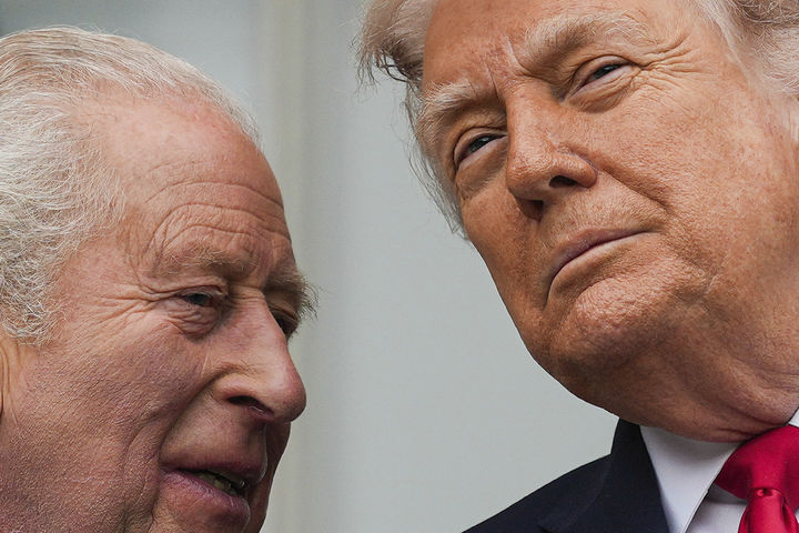 Britain's King Charles III, left, and President Donald Trump, right, speak as troops march past during a State Visit arrival ceremony on the South Lawn of the White House, Tuesday, April 28, 2026, in Washington. (AP Photo/Julia Demaree Nikhinson)