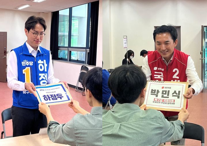 [부산=뉴시스] 이아름 기자 = 14일 부산 북구 선거관리위원회에 후보자 등록을 하고 있는 하정우 더불어민주당 후보(왼쪽)와 박민식 국민의힘 후보. 2026.05.14. aha@newsis.com *재판매 및 DB 금지