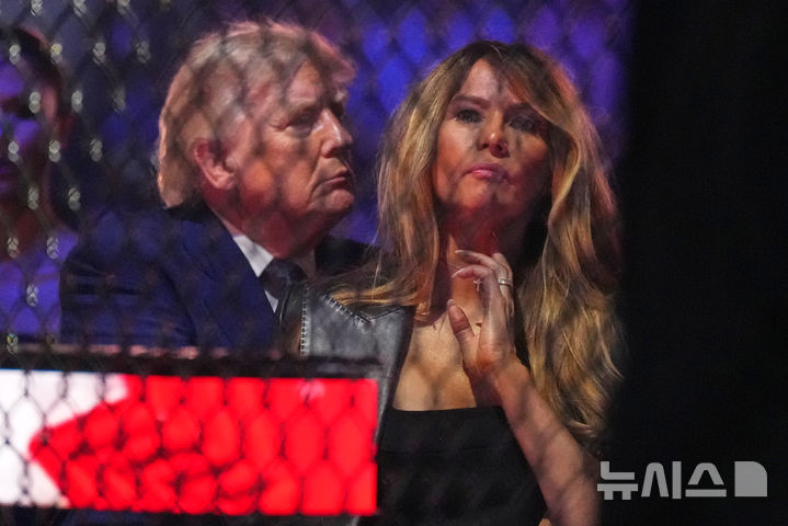 President Donald Trump and first lady Melania Trump attend UFC Freedom 250 on the South Lawn of the White House, Sunday, June 14, 2026, in Washington. (AP Photo/Alex Brandon)